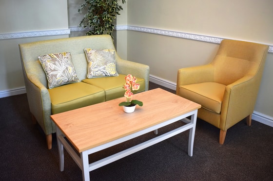 Pendleton Court Care Home - Green sofa and orange chair